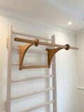 A wooden, sturdy dip bar with a removable pull-up bar that hangs from a wall bar. Perfect for a home gym, for example. product logo