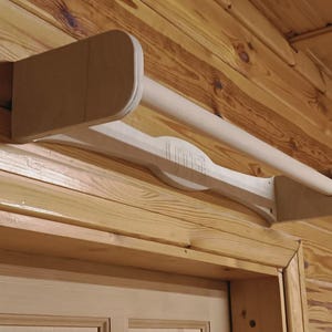 Wooden pull-up bar, wall-mounted, above the door, natural wood