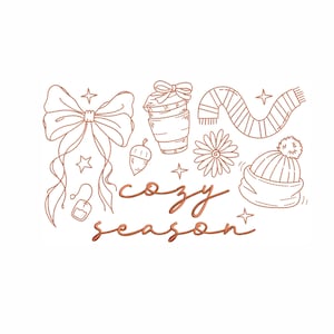 May include: A line art illustration with a cozy theme. It features a bow, coffee cup, scarf, flower, and a hat with a pom-pom. The words "cozy season" are written in cursive script, with stars and an acorn.