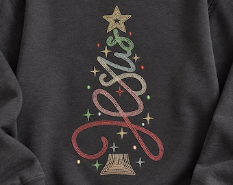 May include: A charcoal gray crewneck sweatshirt featuring an embroidered design of a Christmas tree formed by the cursive word Jesus. The tree is accented with small embroidered stars and dots in red, green, and gold thread colors.