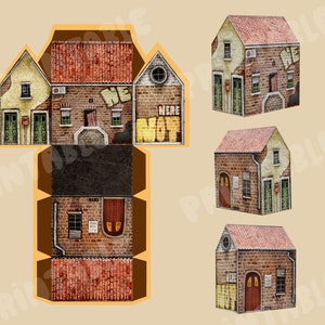 May include: A paper model kit of a brick building with a red roof and a sign that says "We Were Not Here". The model is in various stages of assembly, showing the different parts of the building.