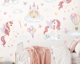 May include: A whimsical wall decal set featuring unicorns, a rainbow, a castle, clouds, butterflies, and hearts in pastel colors. The design includes a hot air balloon and balloons, creating a magical, fairytale theme for a child's bedroom.