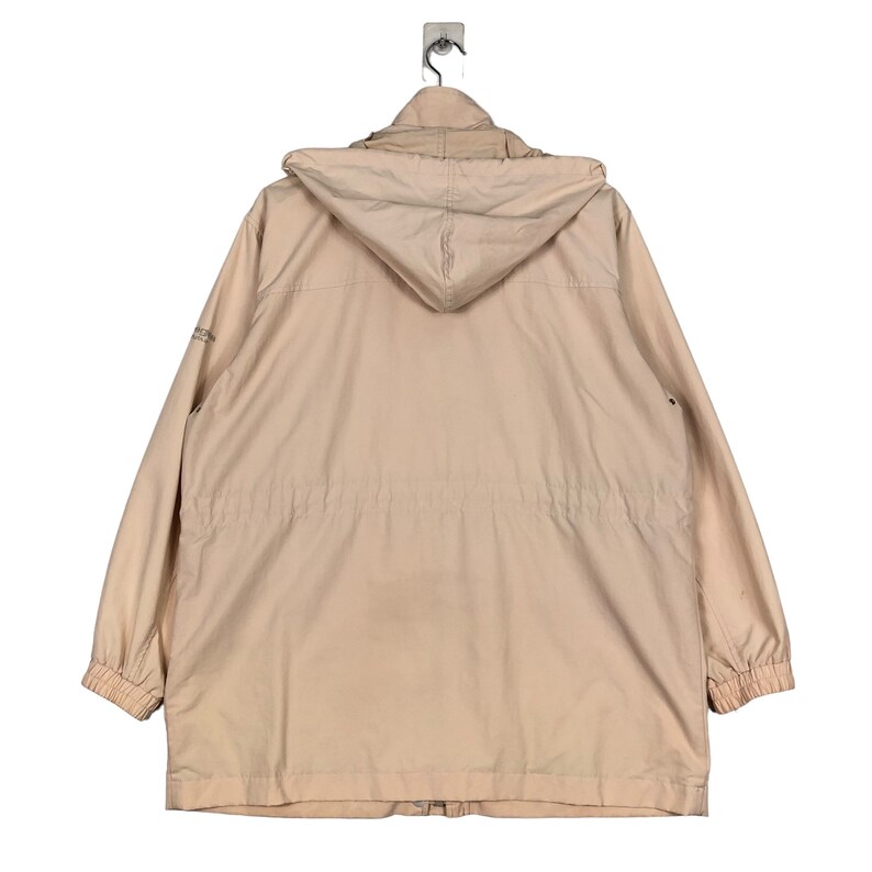 May include: A light beige hooded jacket with a zipper closure and a drawstring waist.