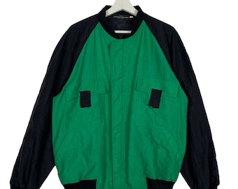 Chaqueta bomber vintage de los 80, inspirada en el desfile de moda de Junko Koshino en Tokio. Fabricada en Japón. Talla grande.