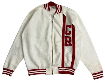 May include: White zip-up jacket with red and white striped sleeves and a red "CR" logo on the right side.