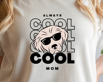 May include: A white t-shirt with a graphic of a dog wearing sunglasses and the text "ALWAYS COOL COOL COOL MOM".