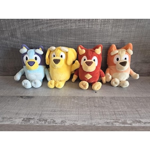 May include: A set of three ceramic mugs with a speckled, matte finish. The mugs are in shades of cream, light gray, and dark gray. Each mug has a simple, minimalist design, perfect for coffee or tea.