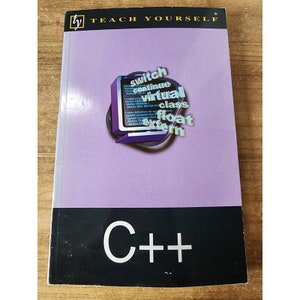 Könnte beinhalten: Ein violettes Buch mit dem Titel "Teach Yourself C++" auf dem Cover. Das Cover zeigt einen Computermonitor mit den Wörtern "switch", "continue", "virtual", "class", "float" und "extern" auf dem Bildschirm.