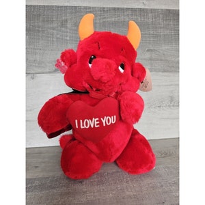 May include: Red plush devil holding a red heart that says "I love you".