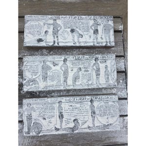 May include: Three rectangular wooden blocks featuring black and white vintage-style illustrations of people performing various physical exercises. Each block displays detailed instructional text and diagrams related to health and fitness routines.