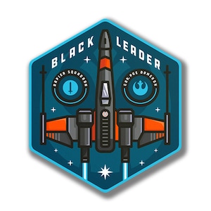 May include: A blue and black hexagonal patch with a stylised X-wing starfighter in the centre. The text "BLACK LEADER" is at the top of the patch. The text "RAPIER SQUADRON" is on the left side of the patch. The text "COR. POE DAMERON" is on the right side of the patch.