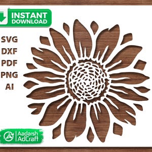 May include: A white sunflower design cut out of a white surface, with a brown wooden background. The image includes the words "Instant Download" and file type options: SVG, DXF, PDF, PNG, and AI. The logo for Aadarsh AdCraft is also present.