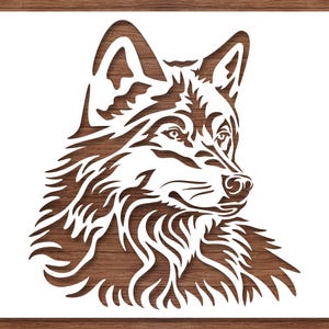 May include: A white stencil of a wolf's head and upper body, set against a wood grain background. The wolf is depicted in profile, with detailed fur and facial features. The stencil is likely for crafting or art projects.