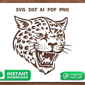 May include: A detailed wood-cut style illustration of a roaring jaguar's head. The image features the text "SVG DXF AI PDF PNG" at the top and "Instant Download" on a green button. The design is suitable for various craft projects.