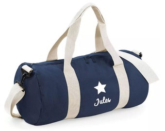 Navy blue and white duffel bag personalized with first name