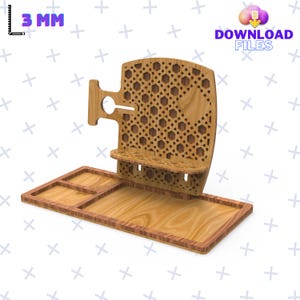 May include: A wooden phone stand with a tray and a decorative back panel. The stand has a cutout for a phone and a small shelf for charging cables. The back panel has a geometric pattern.