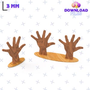 May include: Three wooden hands reaching up from a wooden base. The hands are a light brown colour and have a wood grain texture. The base is a light brown colour and is oval shaped.