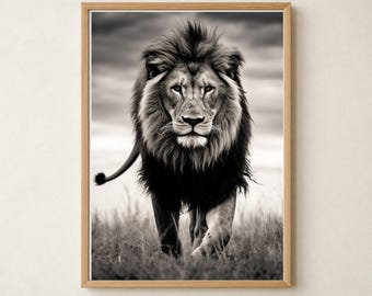 May include: A black and white framed wall art print featuring a forward-facing lion with a full mane walking through tall grass. The lion is captured in sharp detail against a cloudy sky background, enclosed within a light-colored wooden frame.