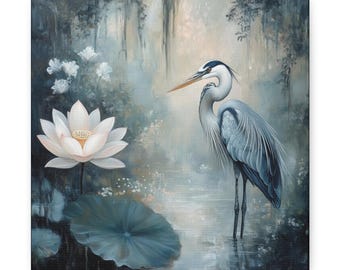 May include: A canvas print featuring a serene waterscape with a blue heron standing in the water. A large white lotus flower and lily pad are in the foreground. The background has a soft, blurred effect with hanging moss.