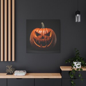 May include: A carved orange pumpkin with a scary face. The pumpkin is on a black background.