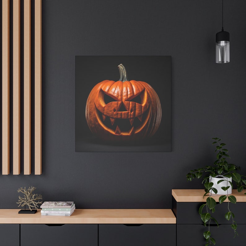 May include: A carved orange pumpkin with a scary face. The pumpkin is on a black background.