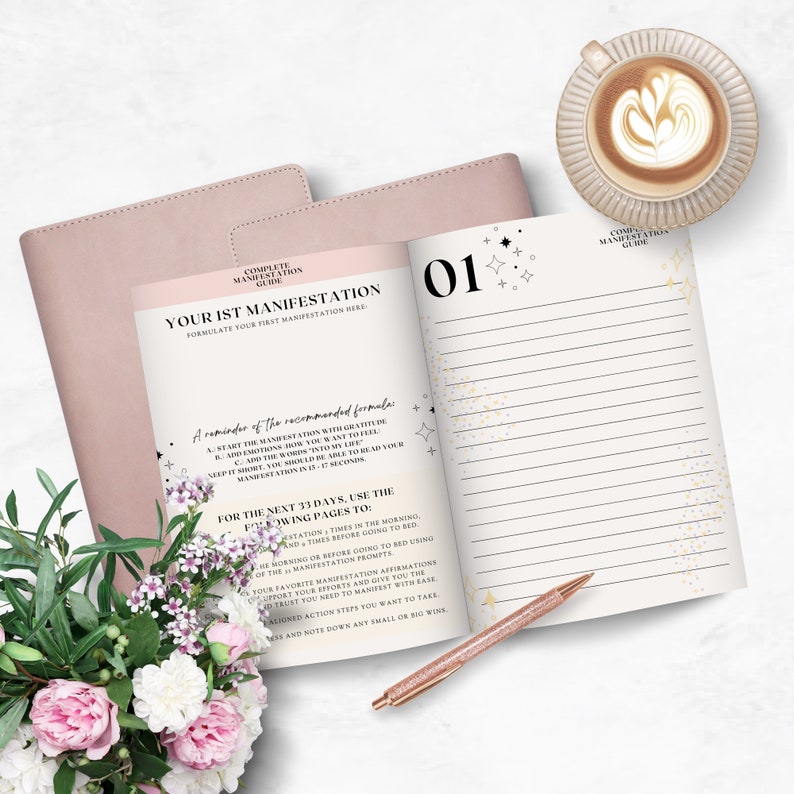 May include: A pink and white journal with gold accents and a gold pen. The journal is open to page 01 and has the text "Complete Manifestation Guide" and "Your 1st Manifestation" on the page. The journal is a tool for self-improvement and goal setting.