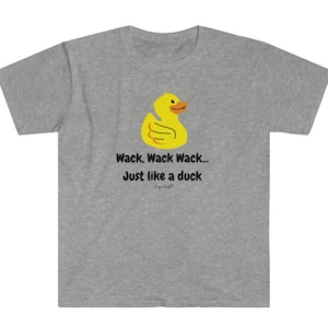 May include: A gray t-shirt with a yellow rubber duck illustration and the text "Wack, Wack Wack... Just like a duck".