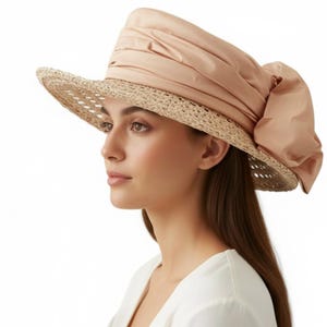 Sombrero tipo cubo vintage Eric Javits color melocotón, con lazo grande, ala de paja, talla 7 1/8.