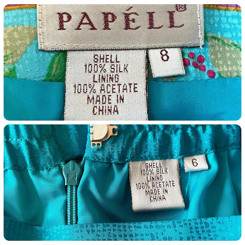 May include: Close-up of two sections of a teal skirt with the brand label "PAPELL". The labels indicate the skirt is made of 100% silk shell and 100% acetate lining. The skirt sizes are 8 and 6.