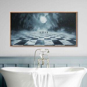 May include: A framed print of a surreal landscape with a chessboard in the foreground. The chessboard is made of white and black squares and is set against a backdrop of a dark forest with a full moon in the sky. The scene is bathed in a soft, blue light.