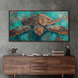 May include: A framed canvas art print featuring a sea turtle. The turtle is depicted in shades of brown and copper, set against a teal and turquoise background. The artwork has a textured, painterly style, and is displayed on a gray wall.
