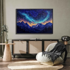 May include: A painting of a mountain range with a starry night sky. The sky is a deep blue with streaks of purple, pink, and green. The mountains are dark blue and silhouetted against the sky.