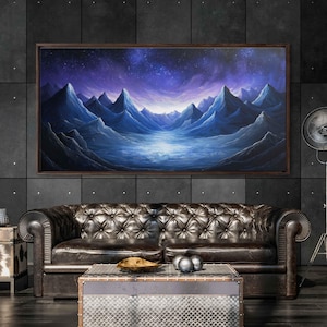 May include: A framed painting of a blue and purple mountain range with a starry sky above. The mountains are reflected in a lake in the foreground.