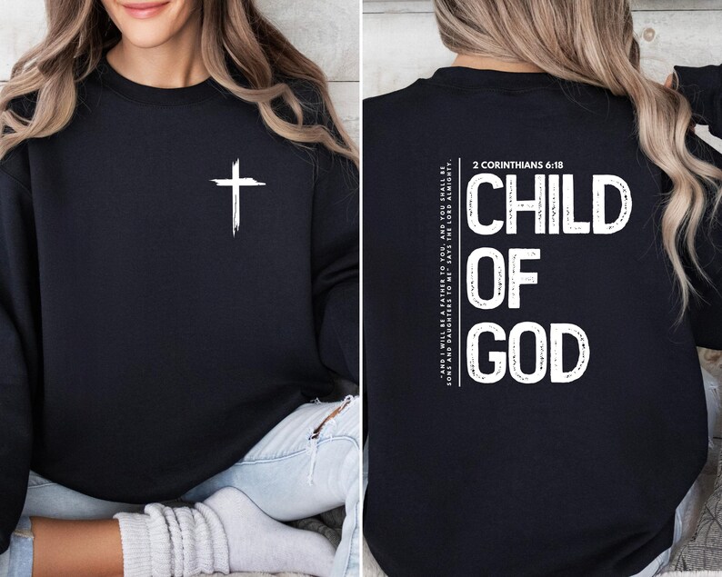 May include: Black sweatshirt with a white cross on the front and the text "CHILD OF GOD" and "2 CORINTHIANS 6:18" on the back.