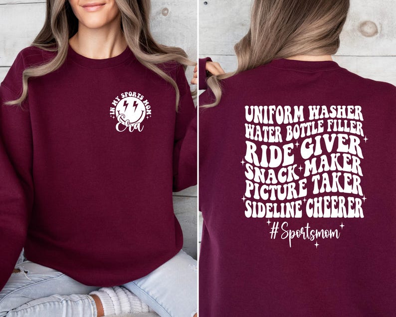 Pode incluir: Camisola de cor bord&ocirc; com texto branco que diz "Eu sou a m&atilde;e esportiva da Eva" na frente e "Lavadora de uniformes, enchimento de garrafas de &aacute;gua, acompanhante, fabricante de lanches, fot&oacute;grafa, animadora de torcida #M&atilde;eEsportiva" nas costas.