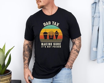 May include: A black t-shirt with a vintage-style graphic that says "Dad Tax Making Sure It's Not Poison". The graphic features a retro sunset with a drink, fries, and an ice cream cone.