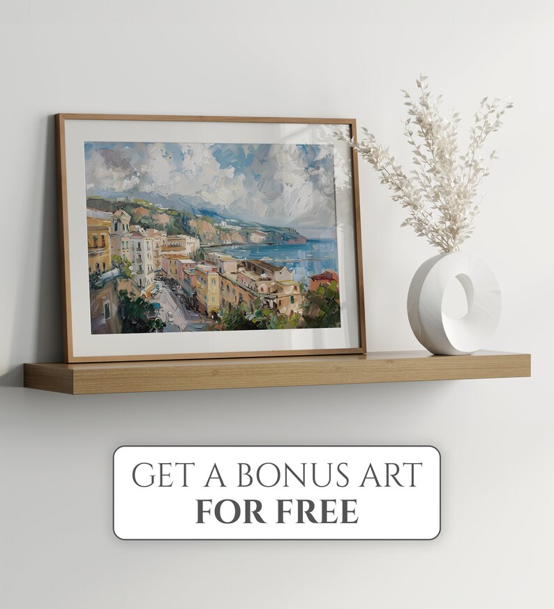 May include: A framed painting of a coastal town with colorful buildings, a blue ocean, and a cloudy sky. The painting is on a wooden shelf with a white vase and dried flowers.