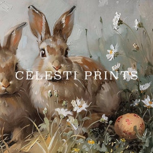 May include: Two brown rabbits with long ears are sitting in a field of white flowers. A pink and white Easter egg is in the foreground.