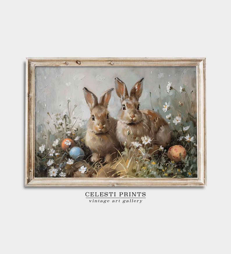 May include: Two brown rabbits sitting in a field of white flowers with colorful Easter eggs. The rabbits are looking at the viewer. The background is a light blue sky.