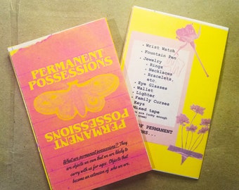 May include: Two postcards with text and illustrations. One is pink and orange with "PERMANENT POSSESSIONS" and a moth graphic. The other is yellow with a list of items like "Wrist Watch" and a floral design.