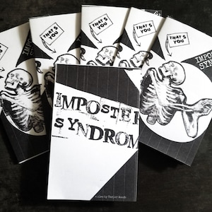 May include: A black and white zine titled "Imposter Syndrome" with a skeleton graphic and the text "That's You" repeated on the cover. The zine is a zine by Harjer Soodn.