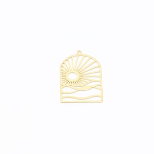 May include: Gold metal charm with a cutout design of a sun rising over the ocean waves.