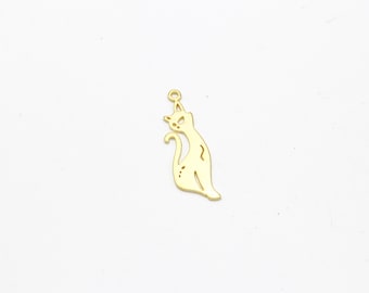 May include: Gold-colored metal charm shaped like a cat. The charm has a loop at the top for attaching to a necklace or bracelet.