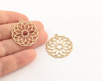 May include: Two gold-colored metal charms in the shape of a circular mandala with a cutout design. The charms have a hole at the top for attaching to jewelry.