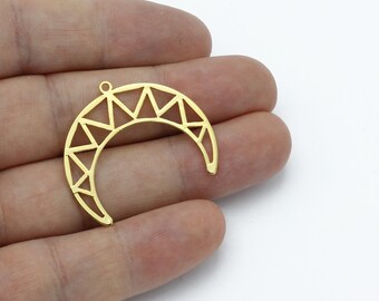 May include: A gold-colored crescent moon pendant with a geometric design. The pendant features a series of triangles within the curved shape, and a small loop at the top for attaching to a chain or other jewelry component. The pendant is likely made of metal.