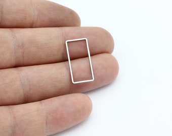 May include: A silver metal rectangle frame with a smooth, polished finish. The frame is empty and ready to be used for a variety of craft projects.