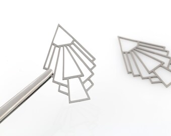 May include: A pair of silver geometric earrings with a fan-like design. The earrings are made of metal and have a modern, minimalist style.