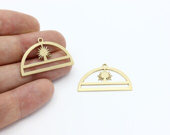 May include: Two gold metal half-circle charms with a sun design and a horizontal line in the center.