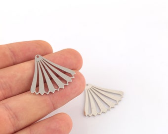 May include: Two silver metal fan-shaped charms with a hole at the top for attaching to jewelry or other crafts.
