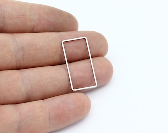 May include: A silver-coloured metal rectangle frame with rounded corners.